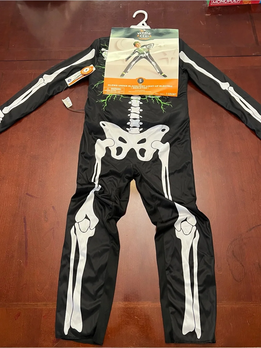 Hyde & EEK! Kids Black Light-Up Skeleton Costume with Glowing Chest (S 6-7)